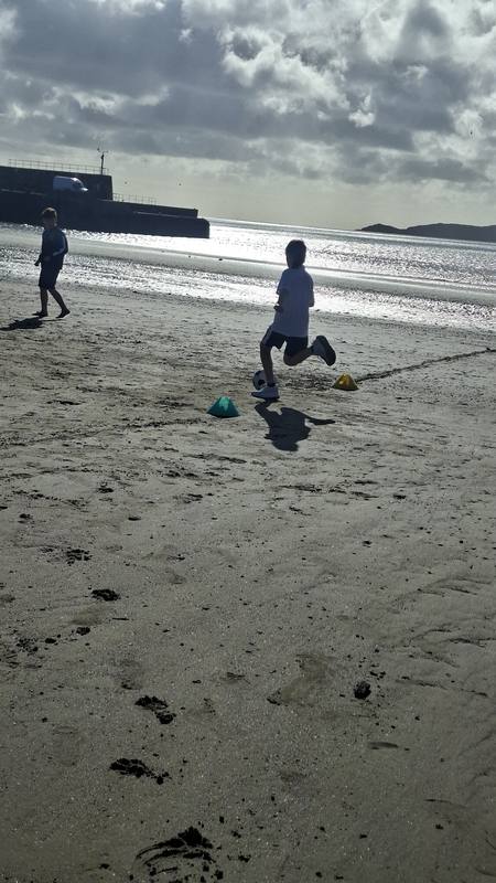 Running on the beach by the pier