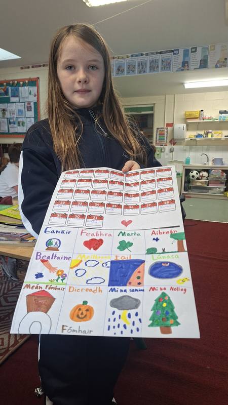 A pupil with her colourful artwork