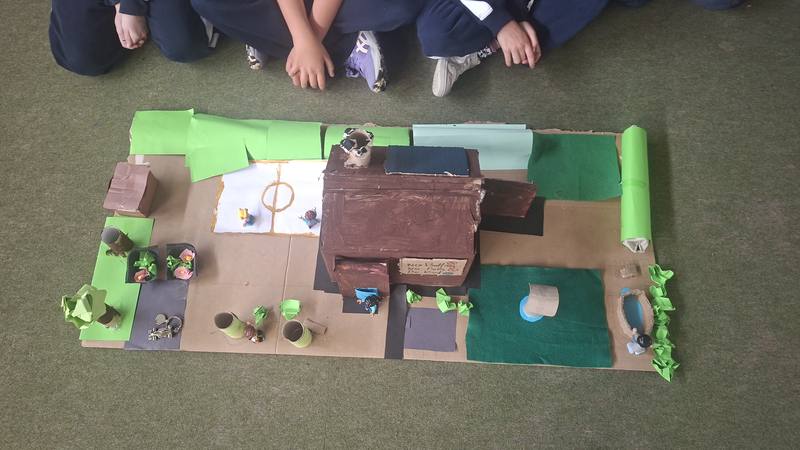A finished model village with houses and fields