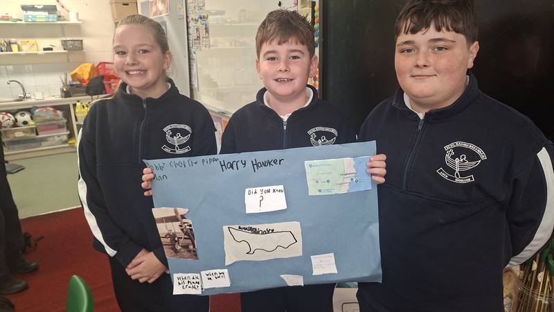 A group with their project poster