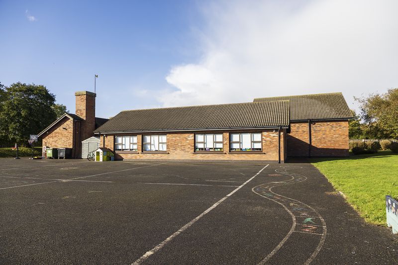 The school yard and building on a bright day