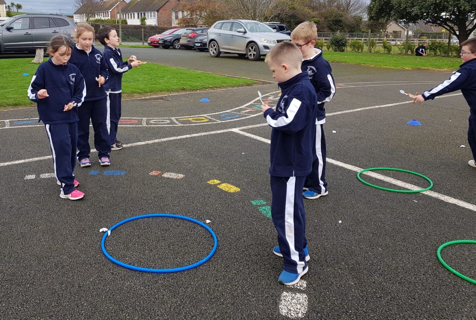 Pupils doing maths with hoops out in the school yard