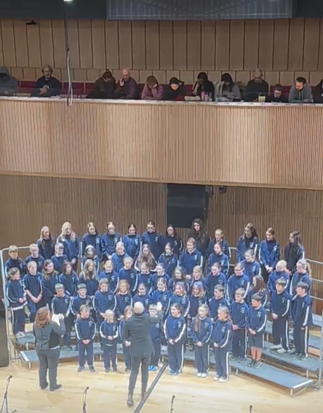 The school choir singing on stage at The Lark